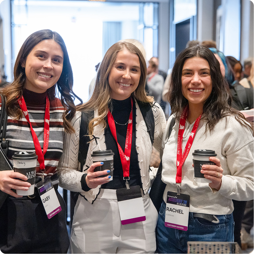 Three Siteimprovers together at a Siteimprove company event.