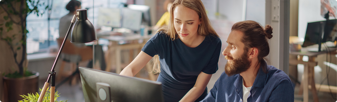Two colleagues collaborating on digital accessibility to create more inclusive online experiences.