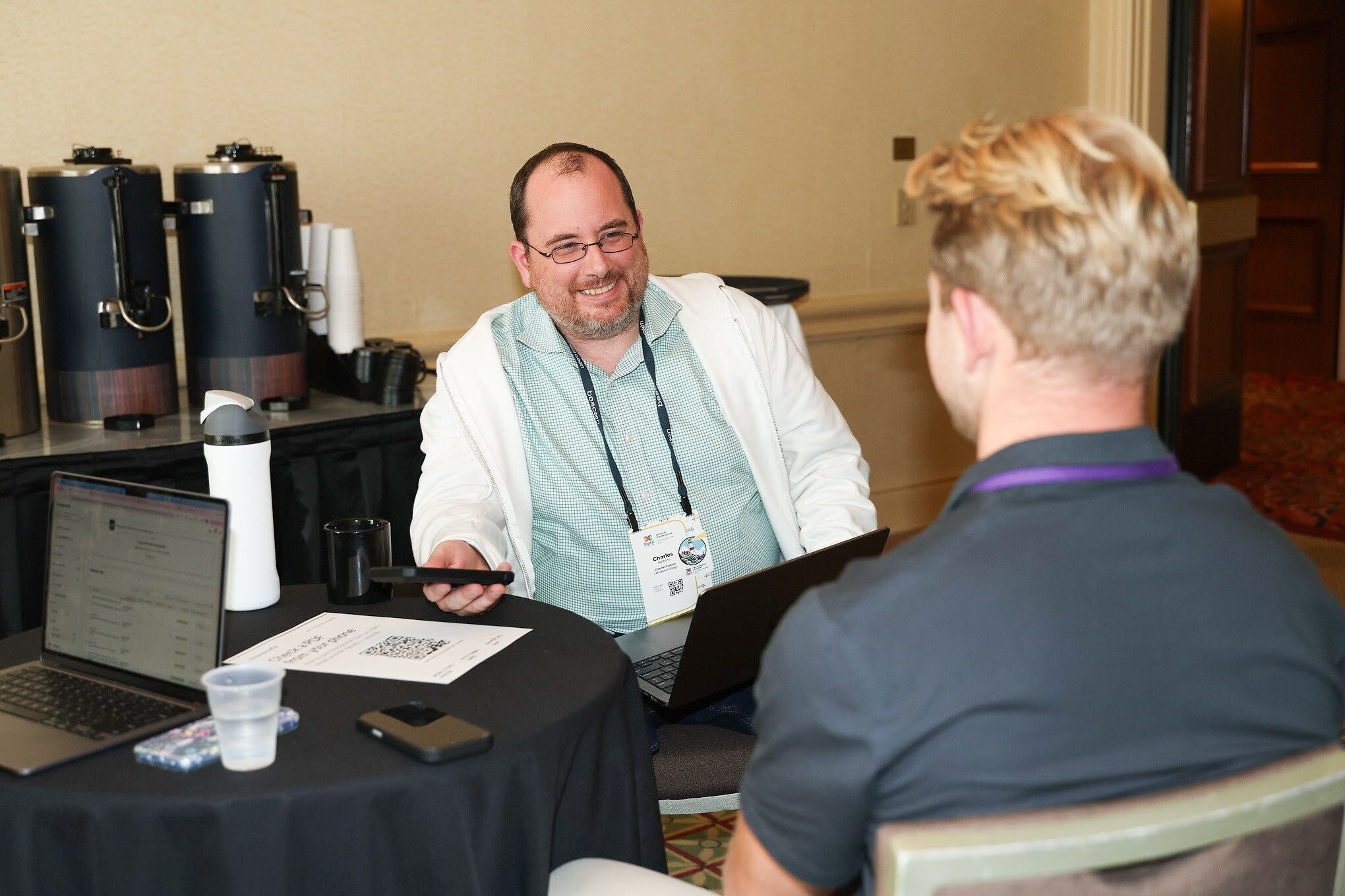 Siteimprove team demonstrating the Siteimprove.ai platform to conference attendees.