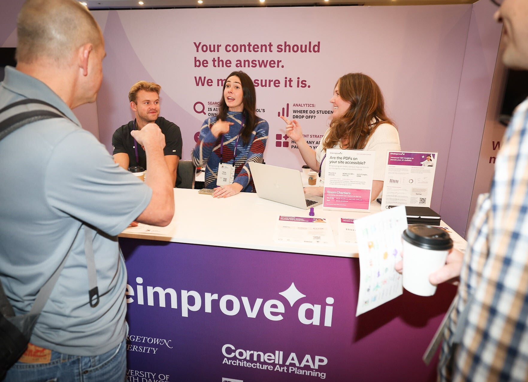 Siteimprove team members at event booth.